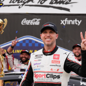 NASCAR Cup Series driver Denny Hamlin (11) and his crew celebrate the win during the Goodyear 400 at Darlington Raceway.