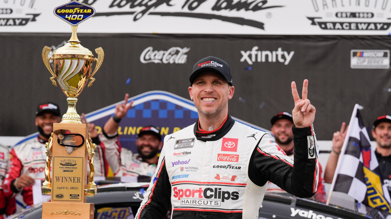 NASCAR Cup Series driver Denny Hamlin (11) and his crew celebrate the win during the Goodyear 400 at Darlington Raceway.