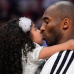 Western Conference guard Kobe Bryant (right) of the Los Angeles Lakers kisses his daughter Natalia Bryant at halftime of the 2013 NBA all star game at the Toyota Center.