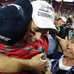 New England Patriots quarterback Tom Brady (12) hugs a family member as mother Galynn Brady (right) looks on after Super Bowl XLIX against the Seattle Seahawks at University of Phoenix Stadium. The Patriots defeated the Seahawks 28-24.