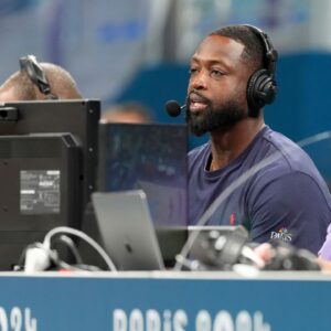 Dwyane Wade looks on from the media bench during the first half between Canada and Greece during the Paris 2024 Olympic Summer Games at Stade Pierre-Mauroy.