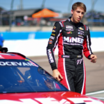 Mar 8, 2025; Avondale, AZ, USA; NASCAR Cup Series driver Carson Hocevar (77) during qualifying for the Shrines Children’s 500 at Phoenix Raceway. Mandatory Credit: Gary A. Vasquez-Imagn Images