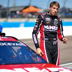 Mar 8, 2025; Avondale, AZ, USA; NASCAR Cup Series driver Carson Hocevar (77) during qualifying for the Shrines Children’s 500 at Phoenix Raceway. Mandatory Credit: Gary A. Vasquez-Imagn Images