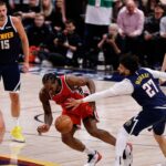 Los Angeles Clippers forward Kawhi Leonard (2) and Denver Nuggets guard Jamal Murray (27) battle for a loose ball in the fourth quarter during game two of first round for the 2025 NBA Playoffs at Ball Arena