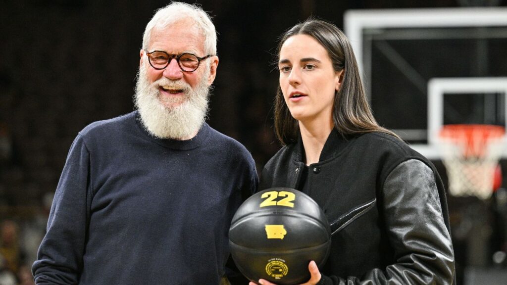Former Iowa Hawkeyes player Caitlin Clark and comedian David Letterman react after the game at Carver-Hawkeye Arena against the USC Trojans. The Hawkeyes retired the jersey of Clark after the game.