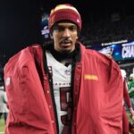 Washington Commanders quarterback Jayden Daniels (5) walks off the field after losing the NFC Championship game against the Philadelphia Eagles at Lincoln Financial Field.