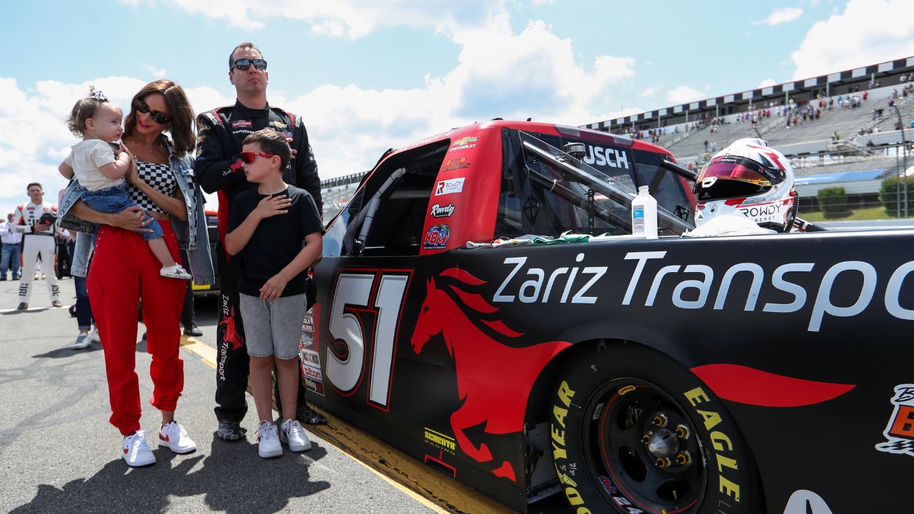 Kyle Busch stands with his wife Samantha Busch and children Brexton and Lennix prior to the CRC Brakleen 150 at Pocono Raceway.