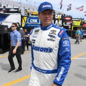 NASCAR Cup Series driver Michael Waltrip (15) walks through the garage area during practice for the Daytona 500 at Daytona International Speedway.
