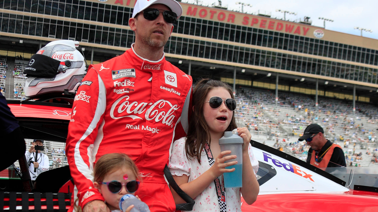 ATLANTA, GA - JULY 10: Denny Hamlin ( 11 Joe Gibbs Racing Coca-Cola Toyota) and his daughters Taylor and Molly on pit road prior to the running of the 53rd NASCAR, Motorsport, USA Cup Series Quaker State 400 presented by Walmart on July 10, 2022 at Atlanta Motor Speedway in Atlanta, GA. (Photo by Jeff Robinson Icon Sportswire) AUTO: JUL 10 NASCAR Cup Series Quaker State 400 Presented by Walmart Icon2207102091400
