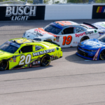 Apr 5, 2025; Darlington, South Carolina, USA; NASCAR Xfinity Series driver Brandon Jones (20) leads driver Christopher Bell (19) and the field into turn one during the Great Clips 200 at Darlington Raceway. Mandatory Credit: Jim Dedmon-Imagn Images