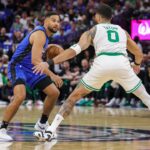 Orlando Magic guard Cory Joseph (10) controls the ball in front of Boston Celtics forward Jayson Tatum (0) during the first quarter of game three of first round for the 2024 NBA Playoffs at Kia Center.