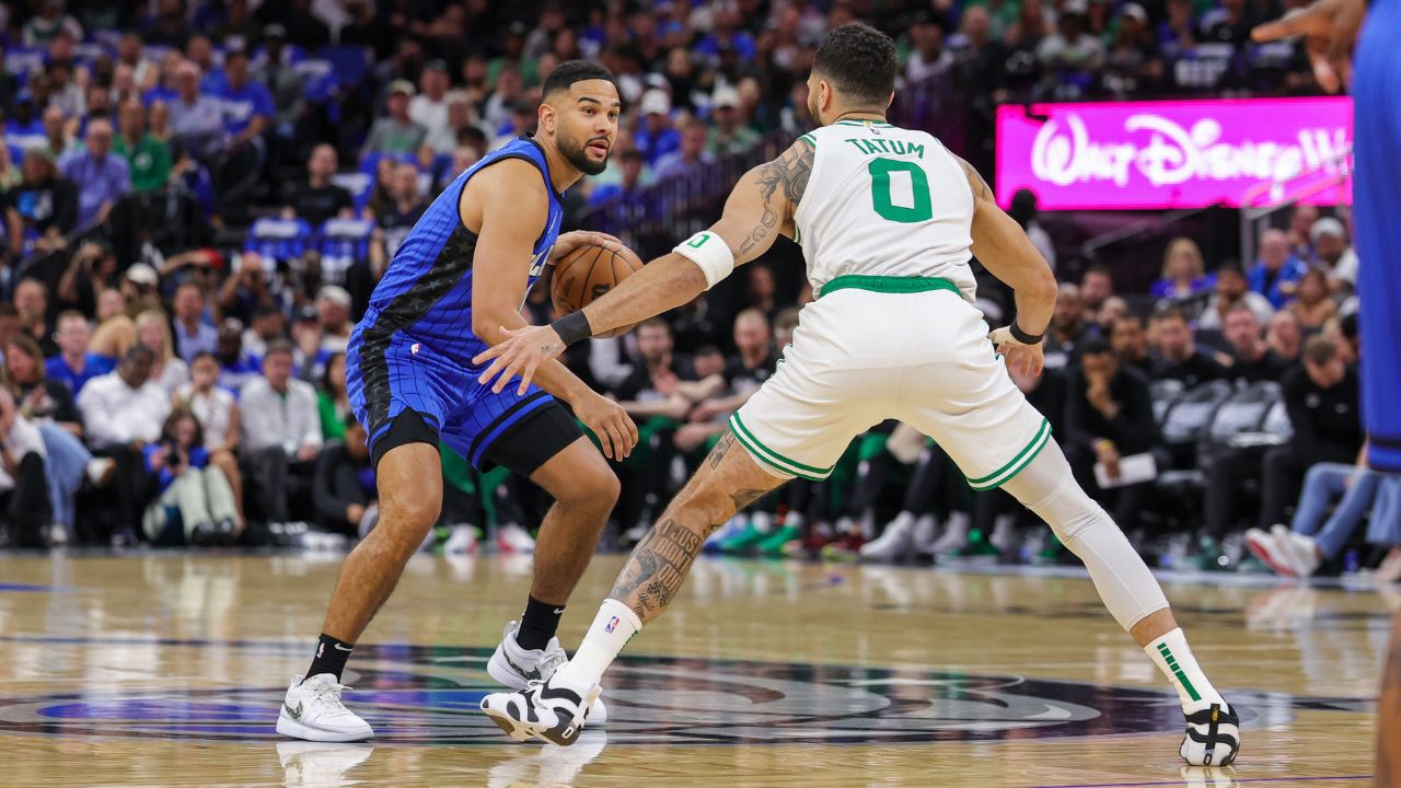 Orlando Magic guard Cory Joseph (10) controls the ball in front of Boston Celtics forward Jayson Tatum (0) during the first quarter of game three of first round for the 2024 NBA Playoffs at Kia Center.