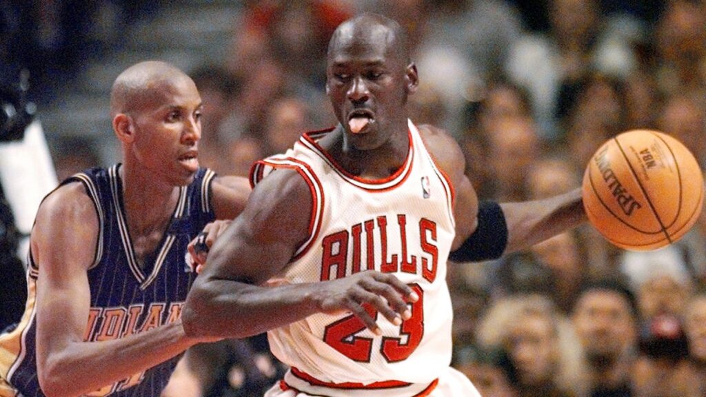 May 31, 1998; Chicago, IL, USA; Chicago Bulls guard Michael Jordan (23), right, is guarded by Indiana Pacers player Reggie Miller (31) in the second half at the United Center. Mandatory Credit: Anne Ryan-USA TODAY