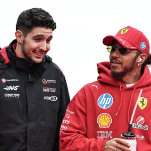 Esteban Ocon of France and the MoneyGram Haas F1 Team and Lewis Hamilton of Great Britain and Scuderia Ferrari look on before the F1 Grand Prix of Japan at Suzuka Circuit in Suzuka, Japan, on April 6, 2025