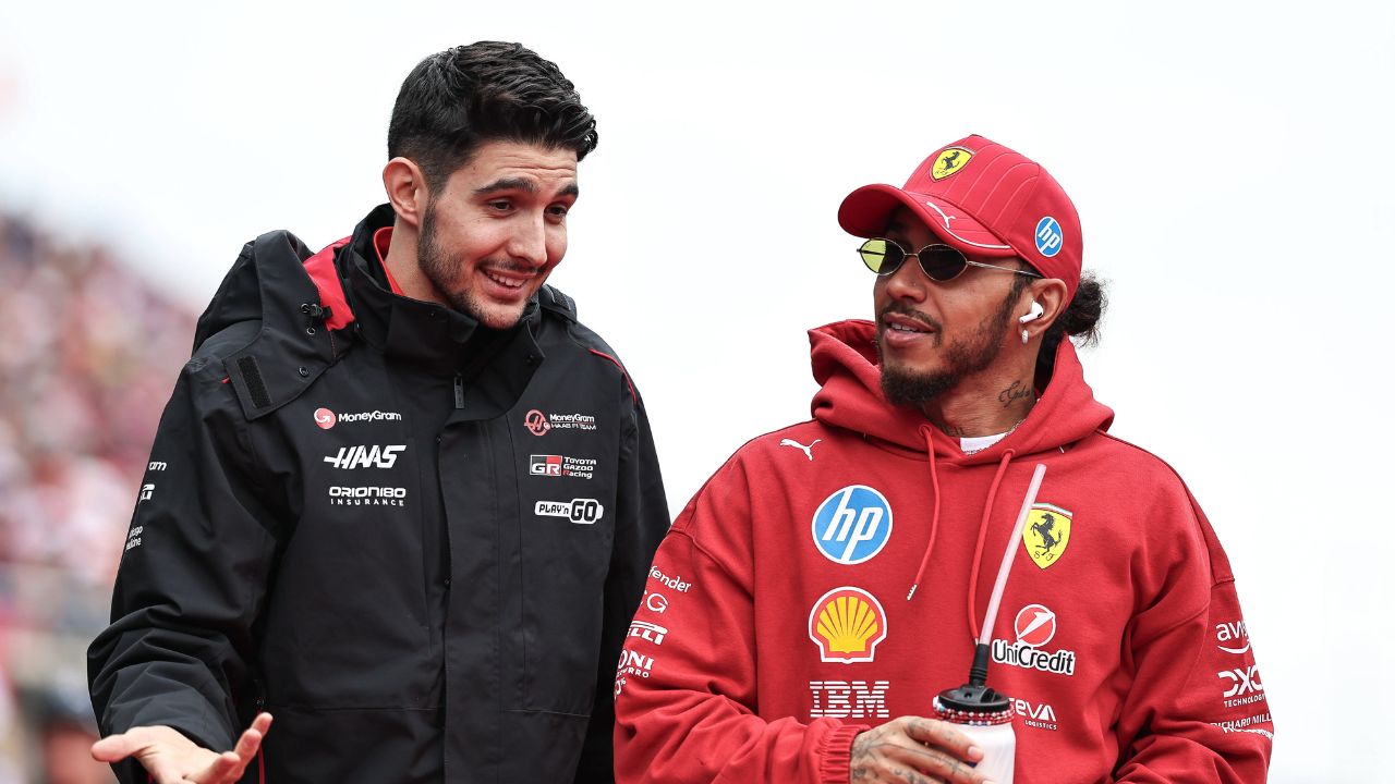 Esteban Ocon of France and the MoneyGram Haas F1 Team and Lewis Hamilton of Great Britain and Scuderia Ferrari look on before the F1 Grand Prix of Japan at Suzuka Circuit in Suzuka, Japan, on April 6, 2025