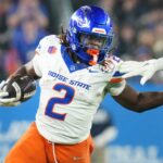 Boise State Broncos running back Ashton Jeanty (2) runs past Penn State Nittany Lions linebacker Kobe King (41) during their Vrbo Fiesta Bowl matchup at State Farm Stadium on Dec. 31, 2024.