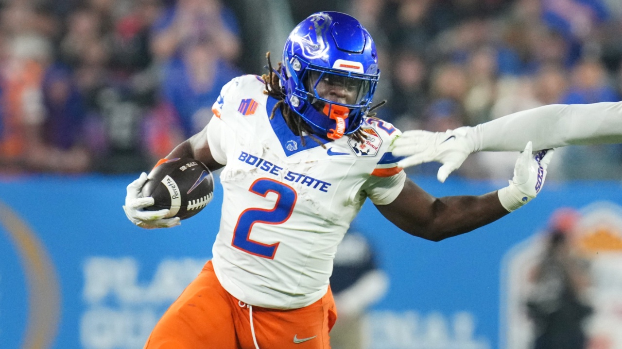 Boise State Broncos running back Ashton Jeanty (2) runs past Penn State Nittany Lions linebacker Kobe King (41) during their Vrbo Fiesta Bowl matchup at State Farm Stadium on Dec. 31, 2024.