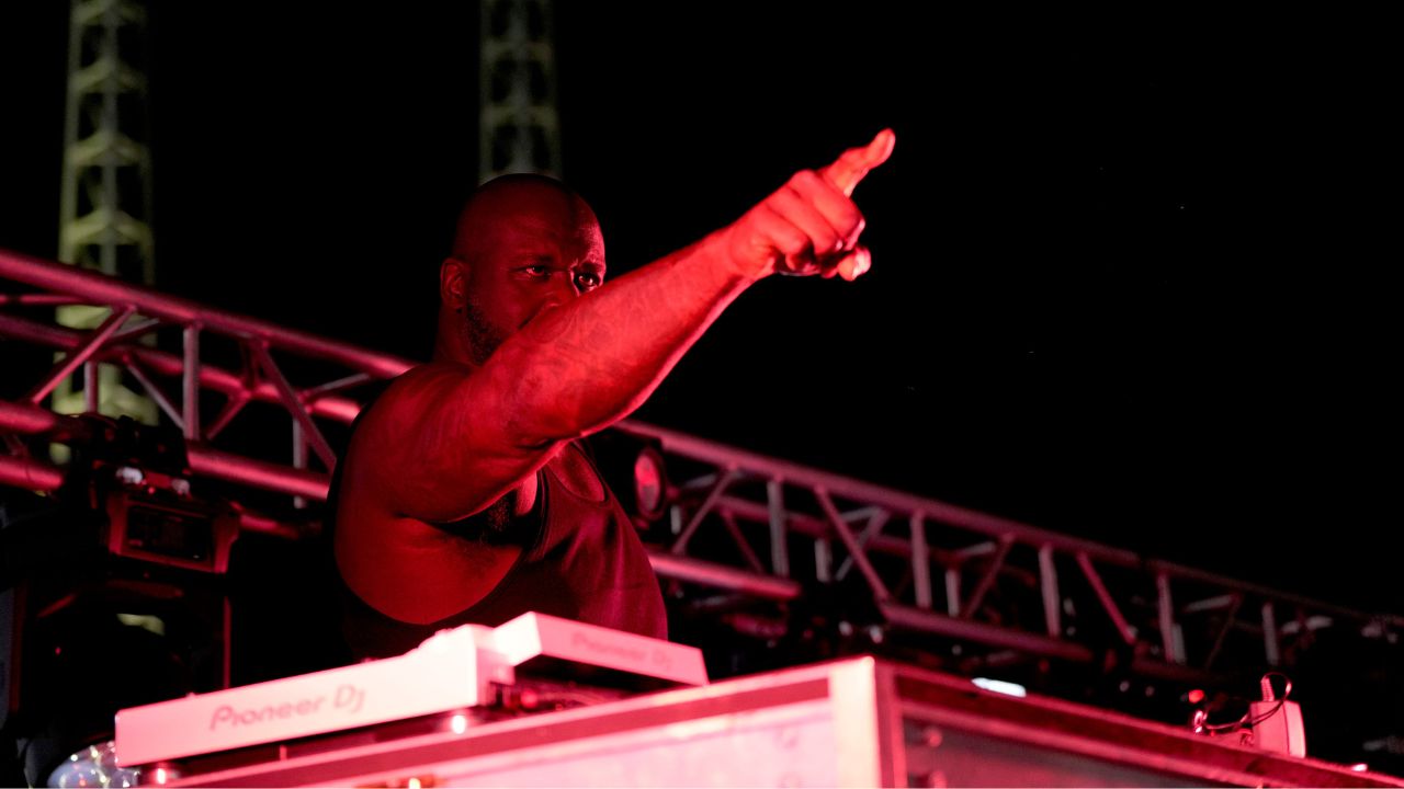 Shaquille O'Neal, also known as Diesel, points to the crowd as he play a wide variety of music after the Reds-Brewers game at Great American Ball Park Saturday, August 31, 2024.