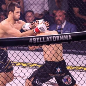 (L-R) Lightweight Champion Usman Nurmagomedov grabs Brent Primus during their fight at the Bellator 300 event at Pechanga Arena