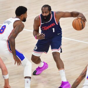 Los Angeles Clippers guard James Harden (1) controls the ball against Philadelphia 76ers forward Paul George (8) during the first half at Intuit Dome