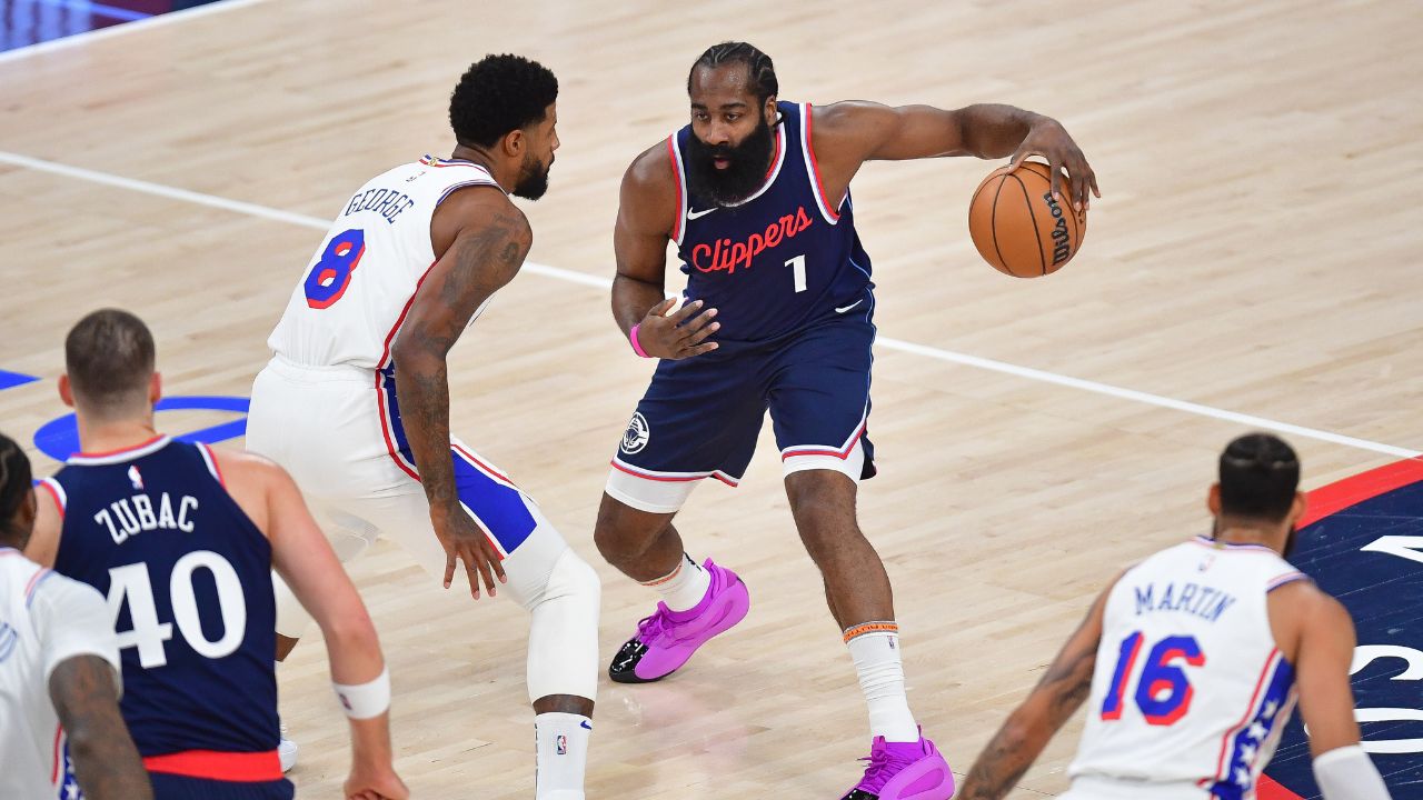 Los Angeles Clippers guard James Harden (1) controls the ball against Philadelphia 76ers forward Paul George (8) during the first half at Intuit Dome