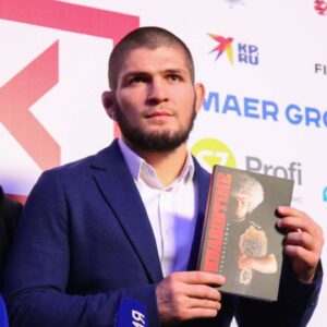 Coach Abdulmanap Nurmagomedov and Russian mixed martial artist, UFC lightweight champion Khabib Nurmagomedov during a press approach after an interview at the Synergy Global Forum business forum at the Olympic Sports Complex in Moscow.