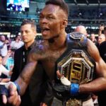 Israel Adesanya of New Zealand celebrates his win against Robert Whittaker of Australia during UFC 243