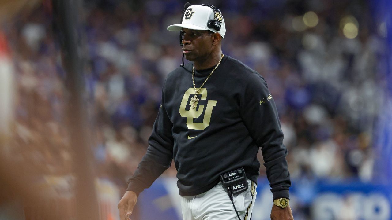 Dec 28, 2024; San Antonio, TX, USA; Colorado Buffaloes head coach Deion Sanders walks on the field during the game against the Brigham Young Cougars at Alamodome.