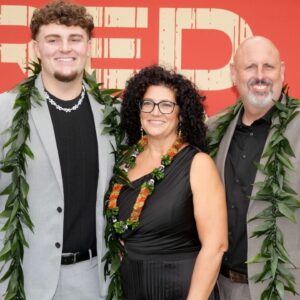 Michigan Wolverines defensive lineman Mason Graham with his parents Allen Graham and Kimberly Graham on the red carpet before the 2025 NFL Draft at Lambeau Field.