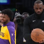 Los Angeles Lakers guard Bronny James (left) and father LeBron James during the game against the Memphis Grizzlies at Crypto.com Arena.