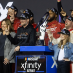 NASCAR Xfinity Series team owner Dale Earnhardt Jr and sister Kelley Earnhardt Miller celebrate with driver Justin Allgaier after winning the 2024 Xfinity Series championship during the Championship race at Phoenix Raceway.