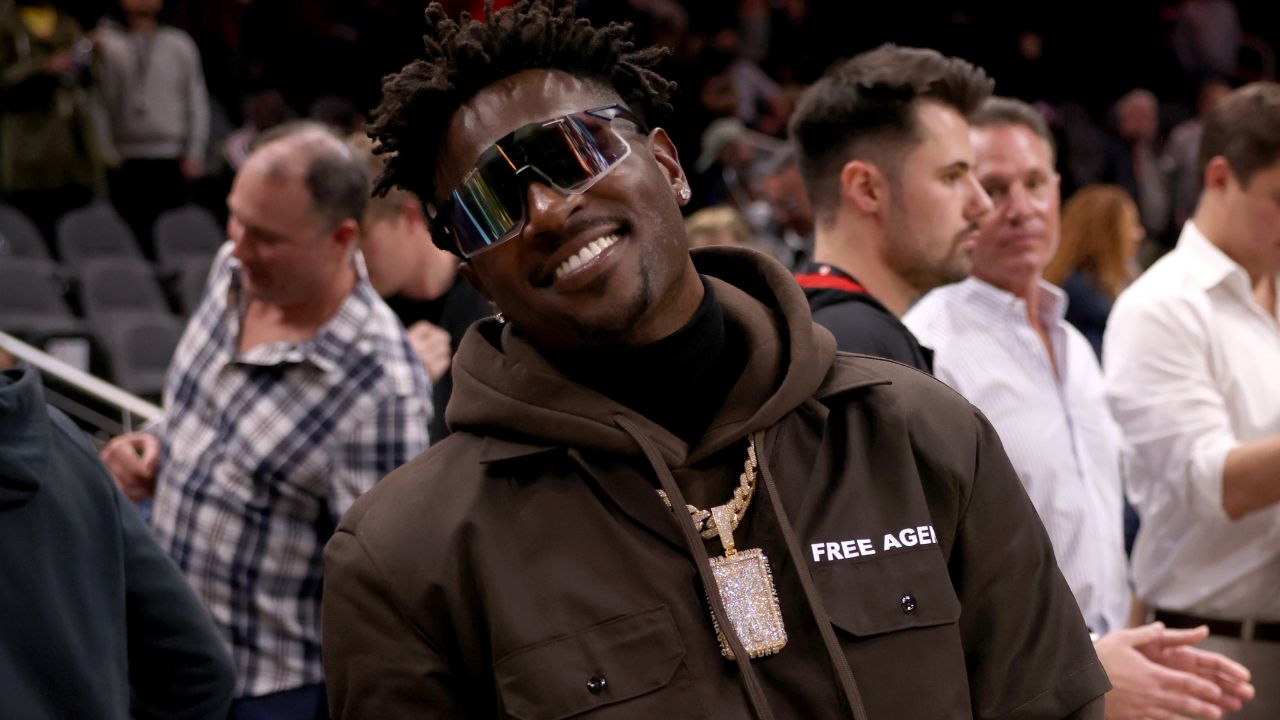 Former Tampa Bay Buccaneers wide receiver Antonio Brown poses for photographers after the game between the Atlanta Hawks and the LA Clippers at State Farm Arena.