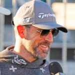 FeJets quarterback Aaron Rodgers talks with the press on the first tee box during the Phoenix Open Annexus Pro-Am at TPC Scottsdale.