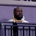 Former NBA player Shaquille O'Neal sits courtside during the first half between the Florida Gators and the LSU Tigers at Exactech Arena at the Stephen C. O'Connell Center.