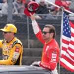 Kyle Busch and Kurt Busch wave to the fans in attendance prior to the 2022 Goodyear 400 at Darlington Raceway.