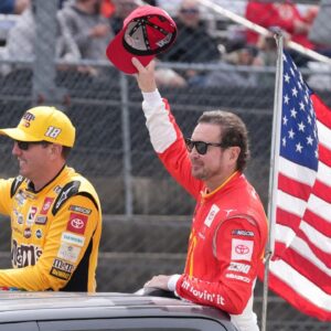 Kyle Busch and Kurt Busch wave to the fans in attendance prior to the 2022 Goodyear 400 at Darlington Raceway.