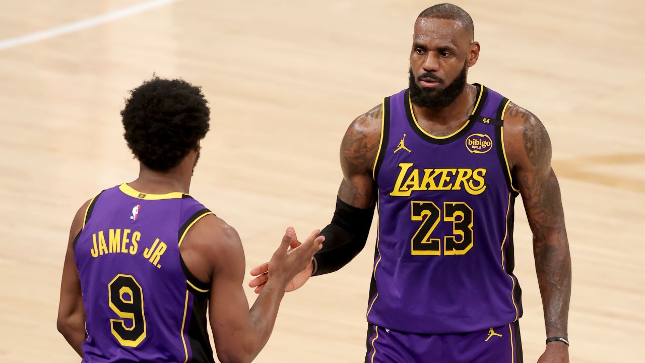 Los Angeles Lakers guard Bronny James (9) checks in for forward LeBron James (23) during the fourth quarter against the New York Knicks at Madison Square Garden