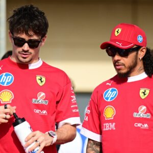 Charles Leclerc of Scuderia Ferrari and Lewis Hamilton of Scuderia Ferrari chat during the race of the Bahrain GP, the 4th round of the Formula 1 World Championship
