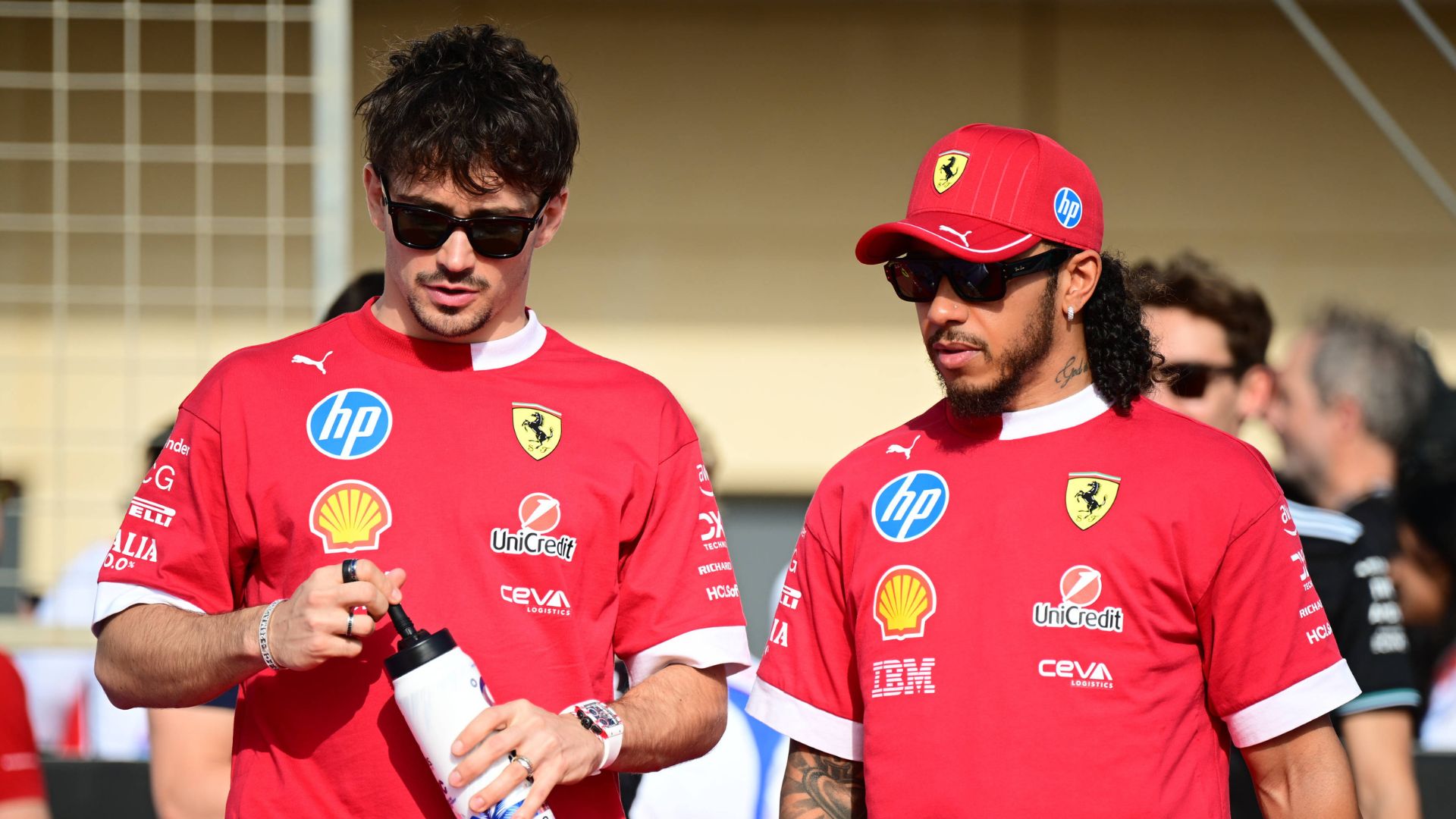 Charles Leclerc of Scuderia Ferrari and Lewis Hamilton of Scuderia Ferrari chat during the race of the Bahrain GP, the 4th round of the Formula 1 World Championship