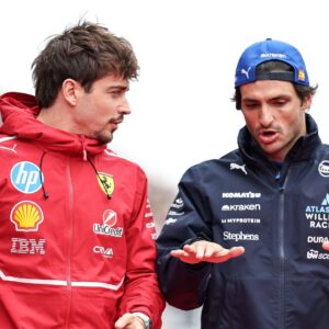 Charles Leclerc of Monaco and Scuderia Ferrari talks with Carlos Sainz Jr of Spain and Atlassian Williams Racing during the drivers' parade before the F1 Grand Prix of Japan