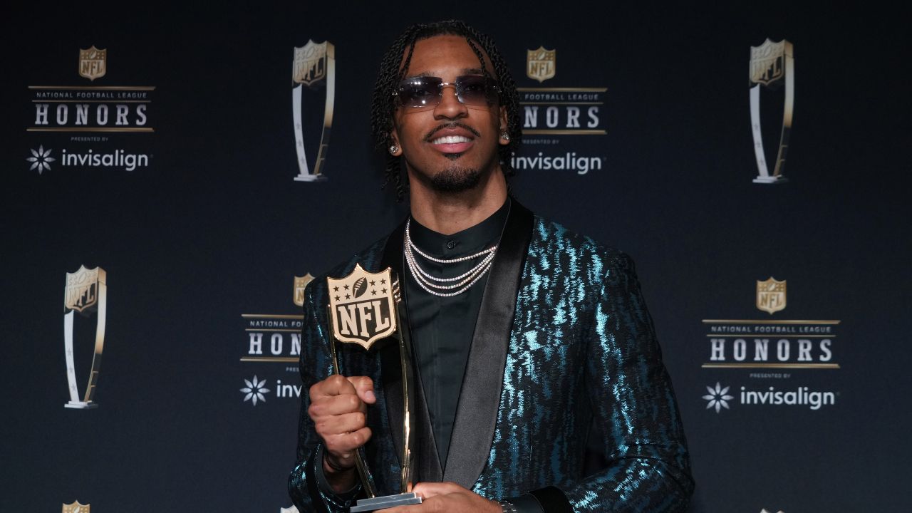 Washington Commanders quarterback Jayden Daniels poses with the Offensive Rookie of the Year award during Super Bowl LIX NFL Honors at Saenger Theatre.