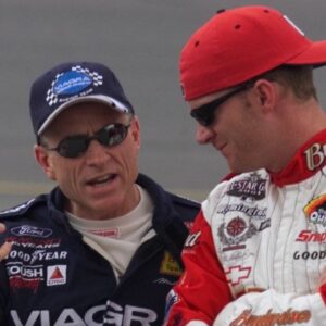 Mark Martin talks with Dale Earnhardt Jr. just before their qualifying runs were called off due to rain Friday afternoon, July 6, 2001 at the Daytona International Speedway.