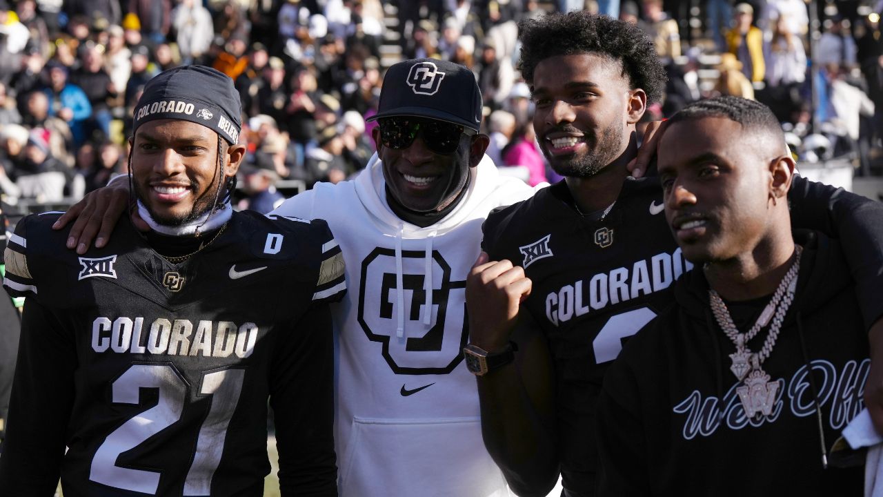 Colorado Buffaloes safety Shilo Sanders (21) and head coach Deion Sanders and quarterback Shedeur Sanders (2) and social media producer Deion Sanders Jr. following the win against the Oklahoma State Cowboys at Folsom Field.