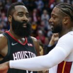 Houston Rockets guard James Harden (13) and Miami Heat guard Dwyane Wade (3) talk on the court after the game at Toyota Center.