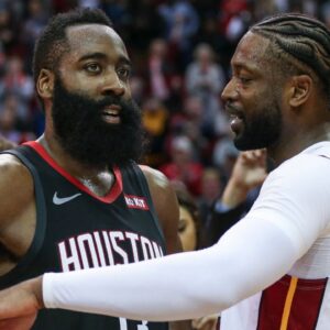 Houston Rockets guard James Harden (13) and Miami Heat guard Dwyane Wade (3) talk on the court after the game at Toyota Center.