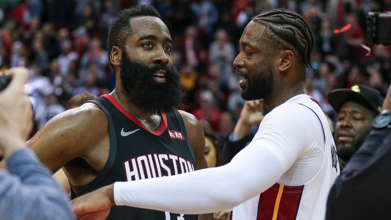 Houston Rockets guard James Harden (13) and Miami Heat guard Dwyane Wade (3) talk on the court after the game at Toyota Center.