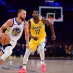 Golden State Warriors guard Stephen Curry (30) moves to the basket agianst Los Angeles Lakers forward Dorian Finney-Smith (17) and guard Luka Doncic (77) during the second half at Crypto.com Arena.