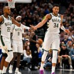 Milwaukee Bucks forward Khris Middleton (22) and forward Giannis Antetokounmpo (34) celebrate during the second quarter against the Dallas Mavericks at the American Airlines Center.