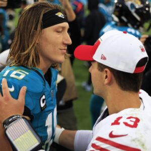 Jacksonville Jaguars quarterback Trevor Lawrence (16) talks with San Francisco 49ers quarterback Brock Purdy (13) after the game of an NFL football game Sunday, Nov. 12, 2023 at EverBank Stadium in Jacksonville, Fla. The San Francisco 49ers defeated the Jacksonville Jaguars 34-3.