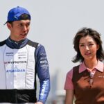 Alexander Albon of Thailand and Atlassian Williams Racing walks with his girl friend Lily He Muni in the paddock during Sprint ahead of the F1 Grand Prix of CHINA at Shanghai International Circuit